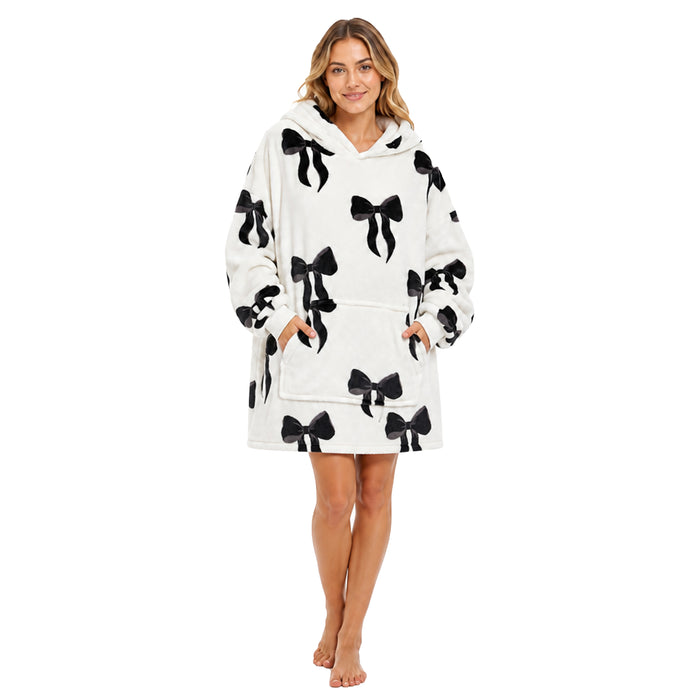 Daisy Dreamer oversized hooded blanket for women, soft fleece hoodie featuring Highland cow and candy cane patterns with bows.