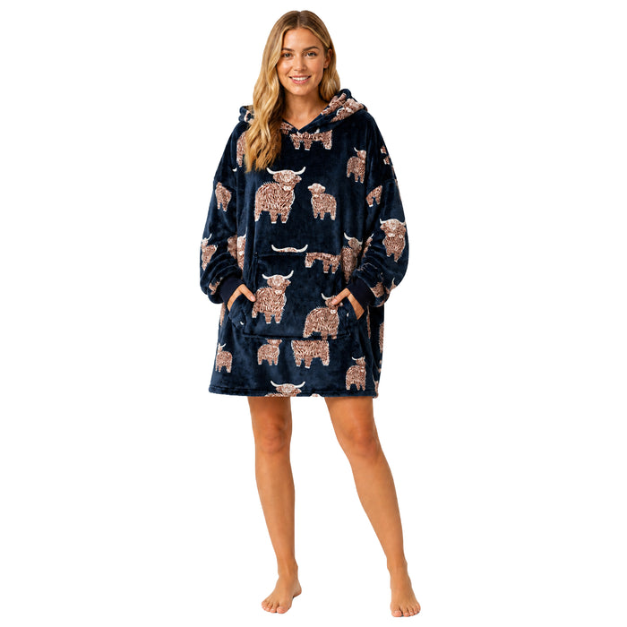Daisy Dreamer oversized hooded blanket hoodie for women in soft fleece with bow details, featuring Highland cow and candy cane patterns.
