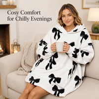 Daisy Dreamer oversized hooded blanket for women, soft fleece hoodie featuring bows, Highland cow and candy cane patterns.