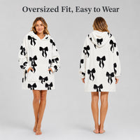 Daisy Dreamer oversized hooded blanket for women featuring a soft fleece fabric with Highland cow and candy cane designs.